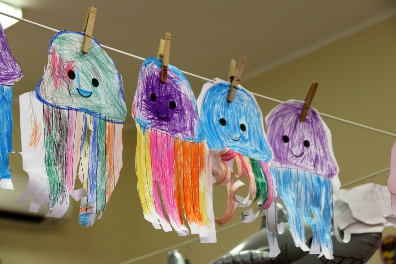 Preschool-age child practicing classroom crafts and drawing, building fine motor skills for kindergarten readiness